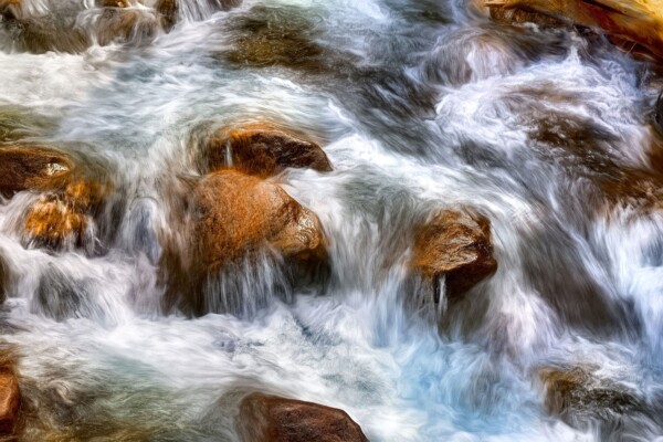 By Michael Piraino Flowing creek rapids in Yosemite National Park in winter