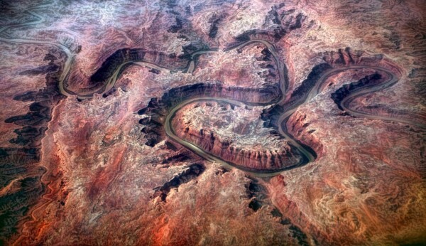 By Michael Piraino Aerial View of River Meandering through a canyon in Utah