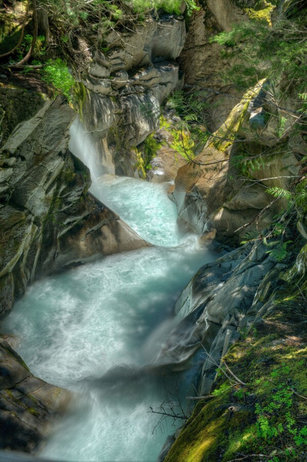 By Michael Piraino Waterfall and emerald green and blue creek Mount Rainier