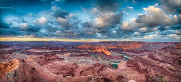 By Michael Piraino Sunrise panorama with clouds and meandering Colorado River