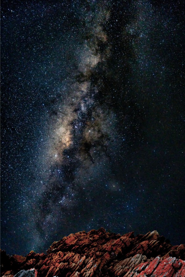 By Michael Piraino Astrophotography of rocky shoreline with Milky Way in Tasmania