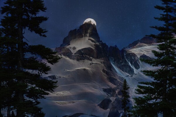 By Michael Piraino Full moon rising behind Little Tahoma Peak at Mount Rainier National Park