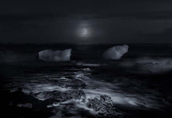 By Michael Piraino Moonrise over Iceland beach with icebergs