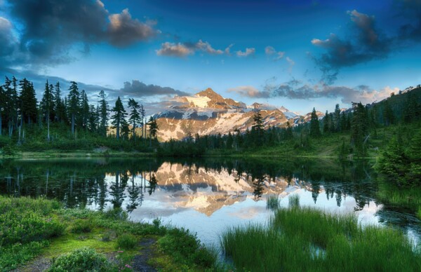 By Michael Piraino Mountain reflected in alpine lake at sunrise