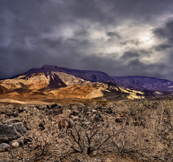 By Michael Piraino Mountain with storm clouds and desert scenery