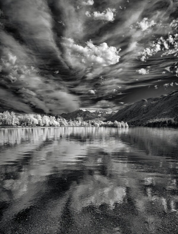 By Michael Piraino infrared black and white clouds and mountains reflections in lake