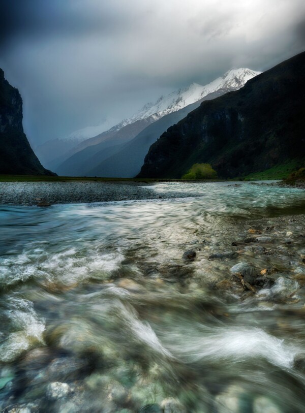 By Michael Piraino River and snow capped mountains, South Island New Zealand