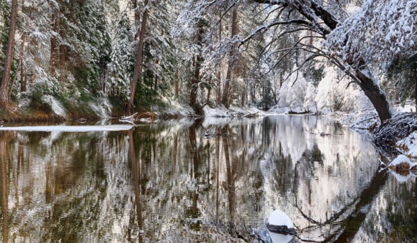 By Michael Piraino Snow and tree reflections in the Merced River, Yosemite Valley
