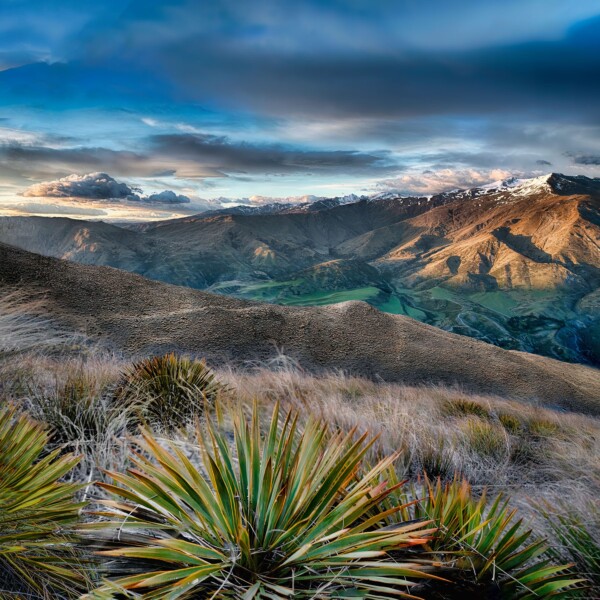 By Michael Piraino Sunrise looking across a valley to distant mountains in New Zealand
