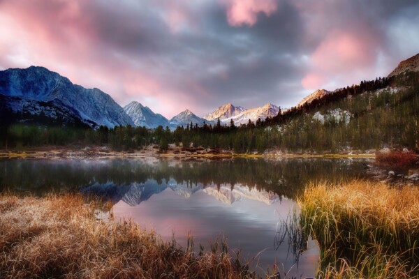 By Michael Piraino Sunrise, clouds and reflections of mountain peaks in an alpine lake