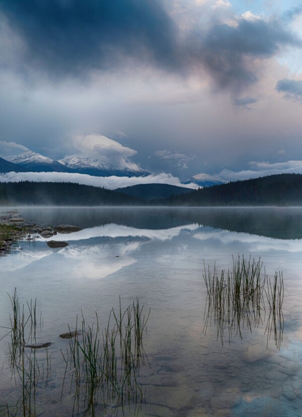 By Michael Piraino Sunrise reflections in lake in Canadian Rocky Mountains Rockies