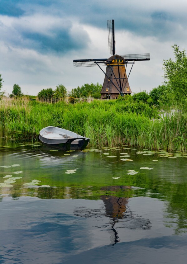 By Michael Piraino Windmills and row boat in the Netherlands