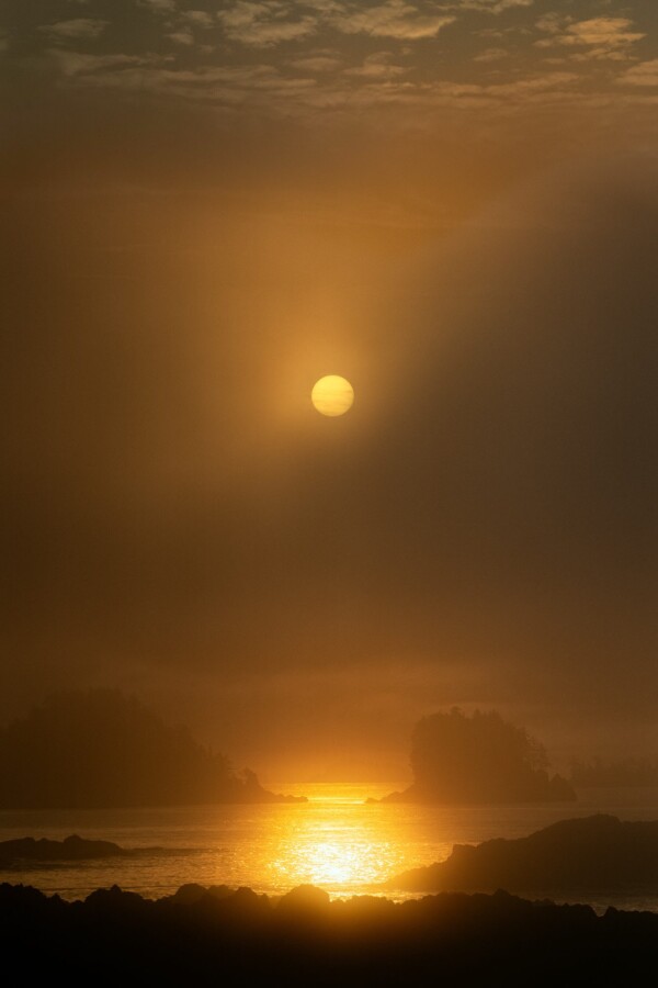 By Michael Piraino Sunrise and water reflections among island in Barkley Sound, Canada