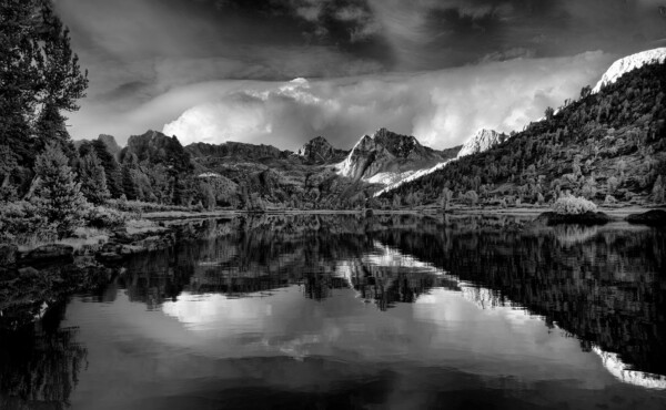 By Michael Piraino Clouds an mountains reflected in Rae Lakes in Kings Canyon National park black and white